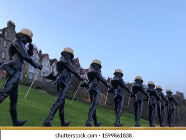 Edinburgh, Scotland / United Kingdom - December 28 2019: Johnnie Walker statues are arranged in order on the Mound in Edinburgh in preparation for the New Year’s Hogmanay celebrations