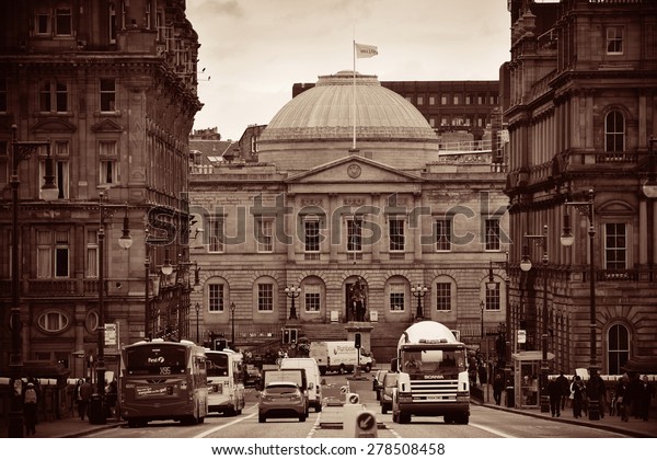 EDINBURGH, UK -\
OCT 8: City street view with traffic on October 8, 2013 in\
Edinburgh. As the capital city of Scotland, it is the largest\
financial centre after London in the\
UK.