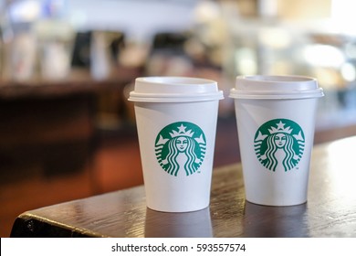 Edinburgh, United Kingdom - 14 February 2017 : Starbucks Take Away, Hot Beverage Coffee Cup With Logo, On The Table In Store. Two Cups, Buy One Get One Free.