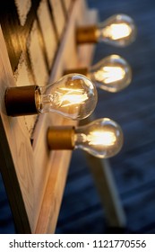 Edison bulbs, screwed into a rectangular frame. Mirror make-up artist, the Seating plan.