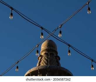 Edison Industrial Bulb String Lights Crossed Over Fountain