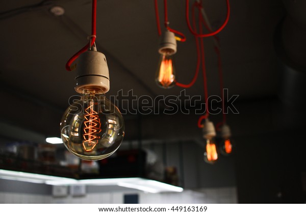 Edison Lamp Red Wire On Concrete Royalty Free Stock Image