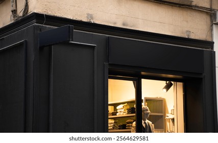 Editable mockup of street clothing store logo with black traditional european storefront