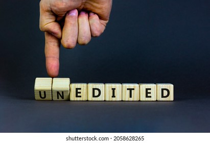 Edited or unedited symbol. Businessman turns wooden cubes and changes the word unedited to edited. Business and edited or unedited concept. Beautiful grey background, copy space.