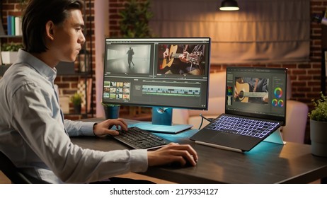 Editing artist working on footage design with media software, using visual effects to edit video montage for colorist production. Designing color gradient on computer. . - Shutterstock ID 2179334127