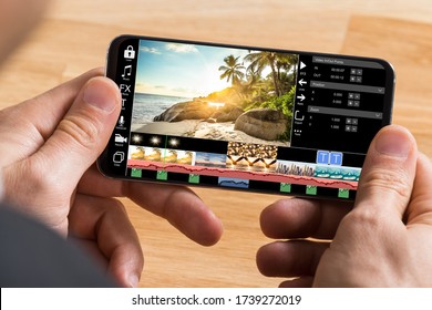 Editing Videos On Mobile Phone Using Video Editor App - Shutterstock ID 1739272019
