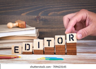 Editor concept. Wooden letters on the office desk, informative and communication background - Shutterstock ID 709623145