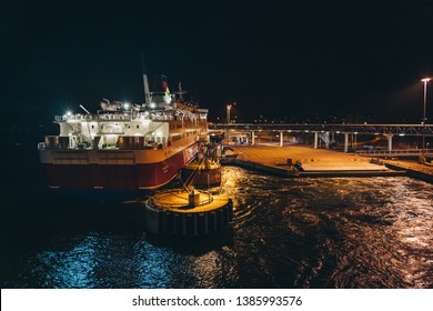 Editorial 03.29.2019 Mariehamn Åland. MS Rosella Moored In The Empty Port At Night Seen From The Leaving MS Silja Symphony