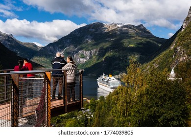 Editorial 09.07.2019 Geiranger Norway Tourists In A Viewpoint Looking At The Famous Geiranger Fjord On A Cold Summer Day