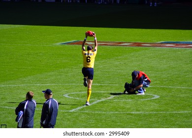 Editorial, Australian Rules Football Umpire About To Bounce Ball