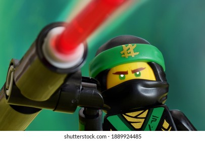 Editorial Illustrative Image Of Lego Ninjago Minifugure Lloyd Green Ninja With Weapon On Defocused Background