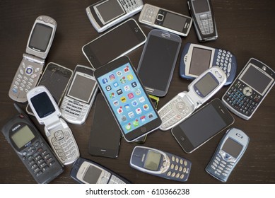 Editorial Illustrative Multiple Cell Phones Old And New Mobile Technology