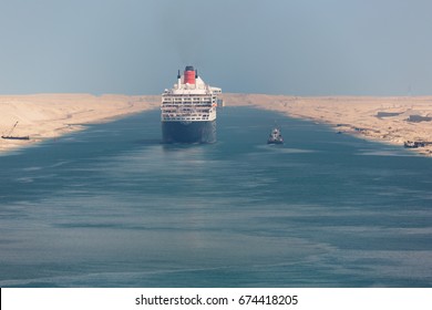 Editorial: ISMAILIA, EGYPT, April 27, 2017 - The Queen Mary 2 Navigating Through The Suez Canal In A Ship Convoy