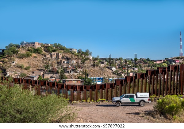 Editorial June 10, 2017 - Border patrol car on the\
US side of the international border between United States and\
Mexico