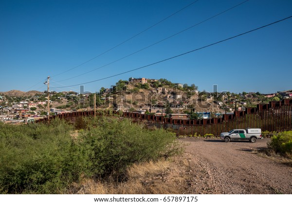Editorial June 10, 2017 - Border patrol car on the\
US side of the international border between United States and\
Mexico