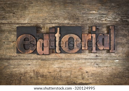 editorial, set with vintage letterpress printing blocks on wooden background