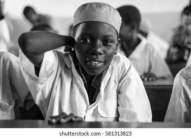 Editorial Use: Boy At School In Zanzibar, Tanzania, 04.2016. Children Face Tremendously Poor Life Conditions In Africa But The Interest In Education Is High. They Are Curious, Witty And Smart. 