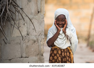 Editorial Use. Even Facing Poor Life Conditions That Affect Food Supplies And Health Care, Children In Rural Africa Are Curious And Joyful. Image Taken In Zanzibar, Tanzania, April 2016.