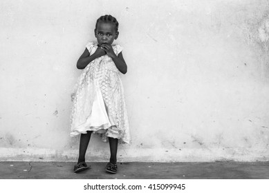 Editorial Use: Girl At School In Zanzibar, Tanzania, 04.2016. Children Face Tremendously Poor Life Conditions In Africa But The Interest In Education Is High. They Are Curious, Witty And Smart.