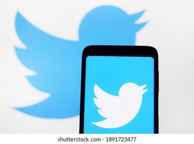 Editorial use, illustrative. In this photo illustration Twitter logo is displayed on a mobile phone and a monitor screen. Kyiv, Ukraine, January 11, 2021.
