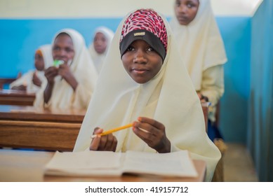 Editorial Use: Muslim Girls At School In Zanzibar, Tanzania, 04.2016. Children Face Poor Life Conditions In Rural Africa But The Interest In Education Is High. They Are Curious, Witty And Smart.