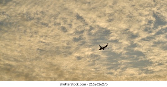 Editorial Use Only; An Airplane Flies Across An Evening Sky Just After Sunset, Taken At Pathumthani, Thailand, In May 2022.     