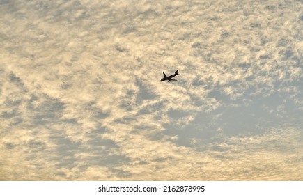 Editorial Use Only; An Airplane Flies Across An Evening Sky Just After Sunset, Taken At Pathumthani, Thailand, In May 2022.     