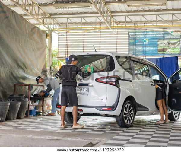 Editorial use only; car being
washed in a car wash, taken at Pathumthani, Thailand, in October,
2018.