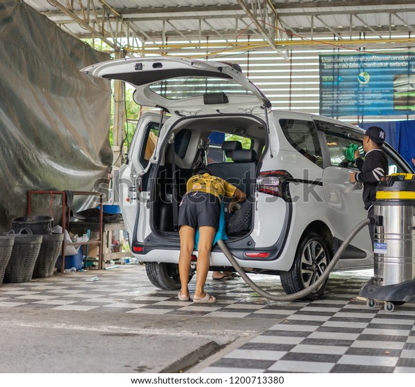Editorial use only; car being\
washed in a car wash, taken at Pathumthani, Thailand, in October,\
2018.