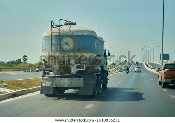 Editorial use only; a cement truck on the road, taken at\
Pathumthani, Thailand, in January 2020.                       \
