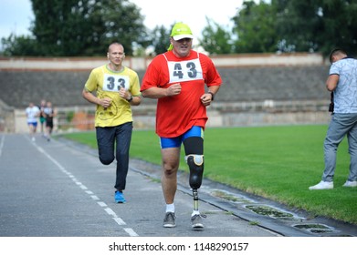 Editorial use only. Disabled athlete with an artificial leg running on a track. Trials among disabled Ukrainian soldiers to the 43 rd US Marine Corps marathon. July 20, 2018. Kiev, Ukraine