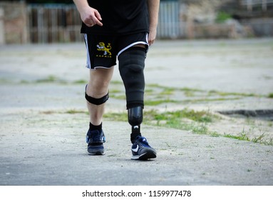 Editorial use only. Disabled runner with an artificial leg walking on a stadium. Trials among Ukrainian soldiers to the 43 rd US Marine Corps marathon. July 20, 2018. Kiev, Ukraine