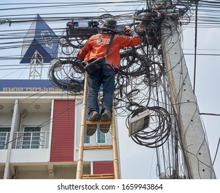 Editorial Use Only; An Electrician Working On An Electricity Pole, Taken At Pathumthani, Thailand, In February 2020.              