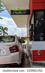 Editorial Use Only: A Fast Food Chain Worker Gives A Customer A Purchased Product At A Drive Thru, Taken At Putrajaya, Malaysia, In October 24, 2019.