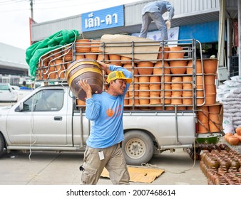 Editorial Use Only; Flowerpots Being Unloaded From A Truck At A Garden Center, Taken At Pathumthani, Thailand, In August 2018.                         