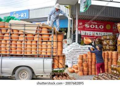 Editorial Use Only; Flowerpots Being Unloaded From A Truck At A Garden Center, Taken At Pathumthani, Thailand, In August 2018.                         