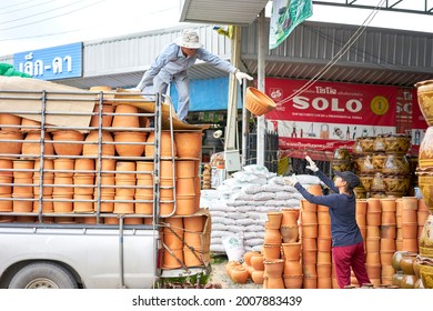 Editorial Use Only; Flowerpots Being Unloaded From A Truck At A Garden Center, Taken At Pathumthani, Thailand, In August 2018.                         