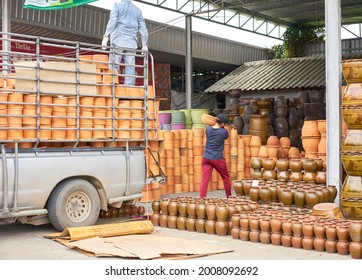 Editorial Use Only; Flowerpots Being Unloaded From A Truck At A Garden Center, Taken At Pathumthani, Thailand, In August 2018.                         