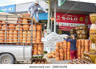 Editorial Use Only; Flowerpots Being Unloaded From A Truck At A Garden Center, Taken At Pathumthani, Thailand, In August 2018.                         