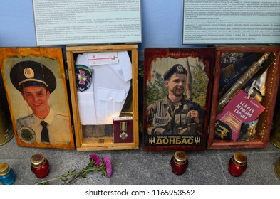 Editorial use only. Flowers, candles and portraits of participant of Russian-Ukrainian war presented on exhibition devoted to the battle of Ilovaisk. August 28, 2017. Kiev, Ukraine