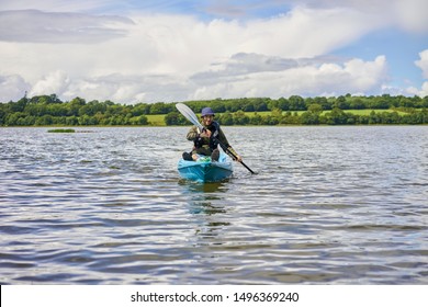 Editorial use only; a man in a canoe on a freshwater lake, taken in Arva, Co. Cavan, Ireland in July 2017.