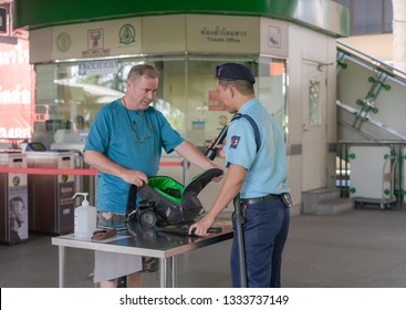 Editorial Use Only; A Man Having His Bag Checked By A Security Officer, Taken At Bangkok Sky Train Station, Bangkok, Thailand, In March, 2019.