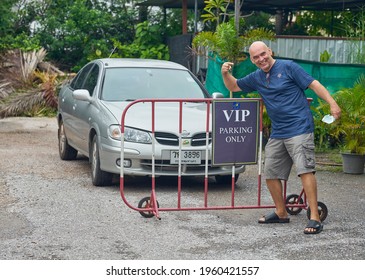 Editorial Use Only; A Man Stands Behind A VIP Parking Sign, In A Car Park, Taken At Phetchaburi, Thailand, In November 2020.            