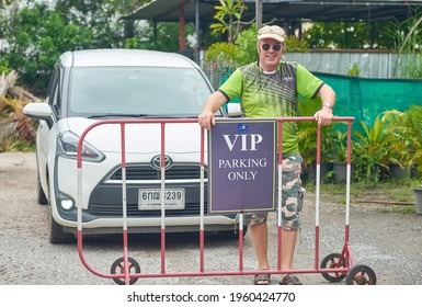 Editorial Use Only; A Man Stands Behind A VIP Parking Sign, In A Car Park, Taken At Phetchaburi, Thailand, In November 2020.            