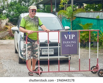 Editorial Use Only; A Man Stands Behind A VIP Parking Sign, In A Car Park, Taken At Phetchaburi, Thailand, In November 2020.            