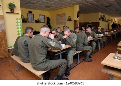 Editorial Use Only. At A Mess Hall: Soldiers Sitting At Set-out Tables And Eating. November 12, 2018. Novo-Petrivtsi Military Base, Ukraine