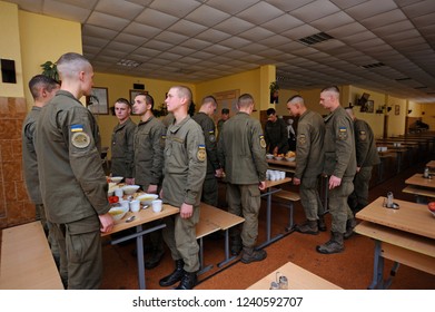 Editorial Use Only. At A Mess Hall: Soldiers Standing At Set-out Tables, Praying Before Having Dinner. November 12, 2018. Novo-Petrivtsi Military Base, Ukraine