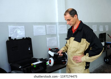 Editorial Use Only. New Radiation Detectors Testing. Dosimetrist Holding A Handheld Radiation Isotope Identifier, Black Boxes On A Background. October 1, 2018. State Corporation “Radon”. Kiev,Ukraine 