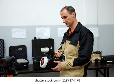 Editorial Use Only. New Radiation Detectors Testing. Dosimetrist Holding A Handheld Radiation Isotope Identifier, Black Boxes On A Background. October 1, 2018. State Corporation “Radon”. Kiev,Ukraine 