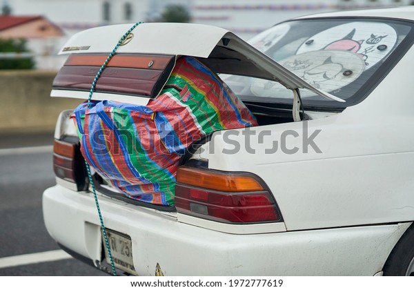 Editorial use only; an overloaded car trunk, driving on
the road, taken at Bangkok, Thailand, taken in October, 2020.      
     